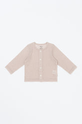 avauma Little Shell Cardigan – Almond Cream color baby cardigan laid flat, lightweight and breathable knit.